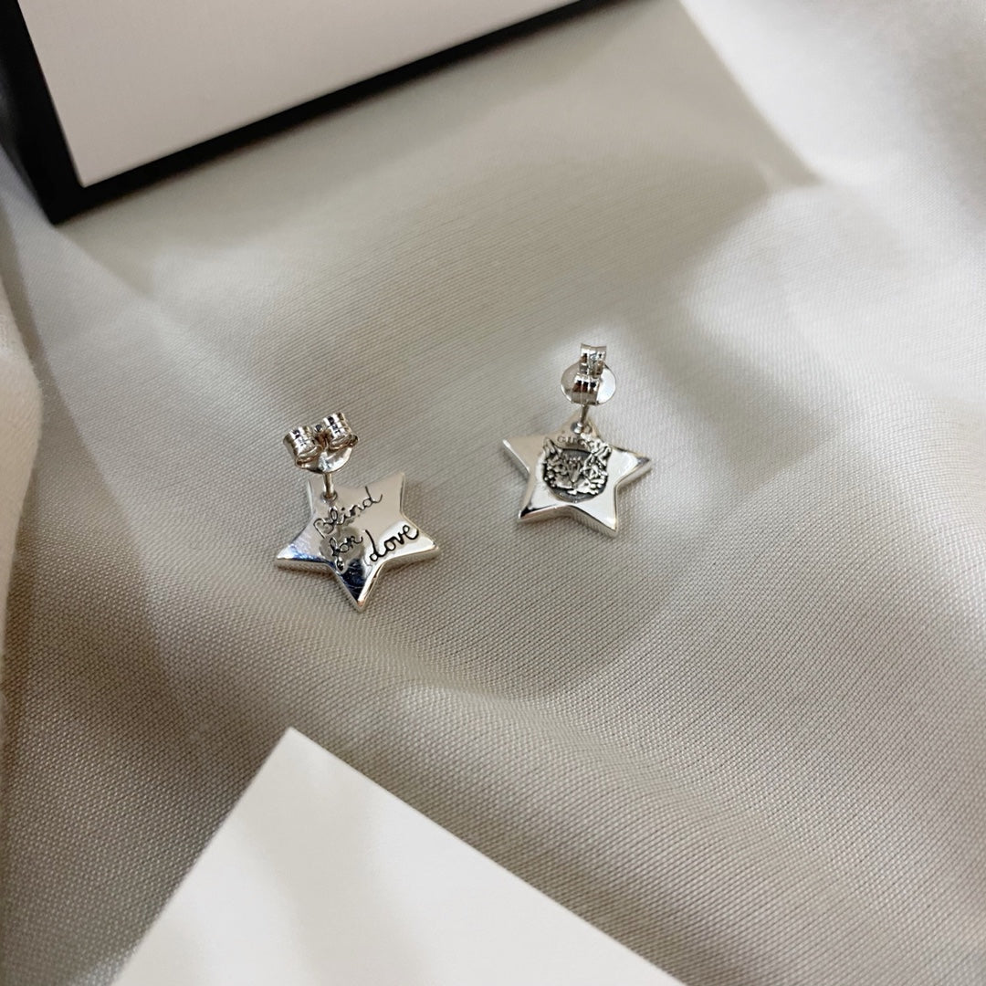 SILVER BLIND FOR LOVE STAR EARRINGS - Image 6