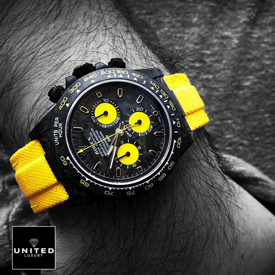 Rolex Daytona DiW NTPT “All Carbon Lemon Edition” Replica on his arm